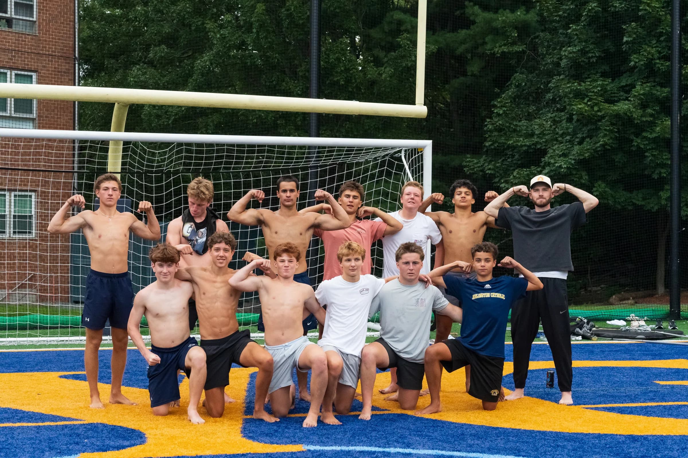The Arlington Catholic Hockey group flexing after a field session