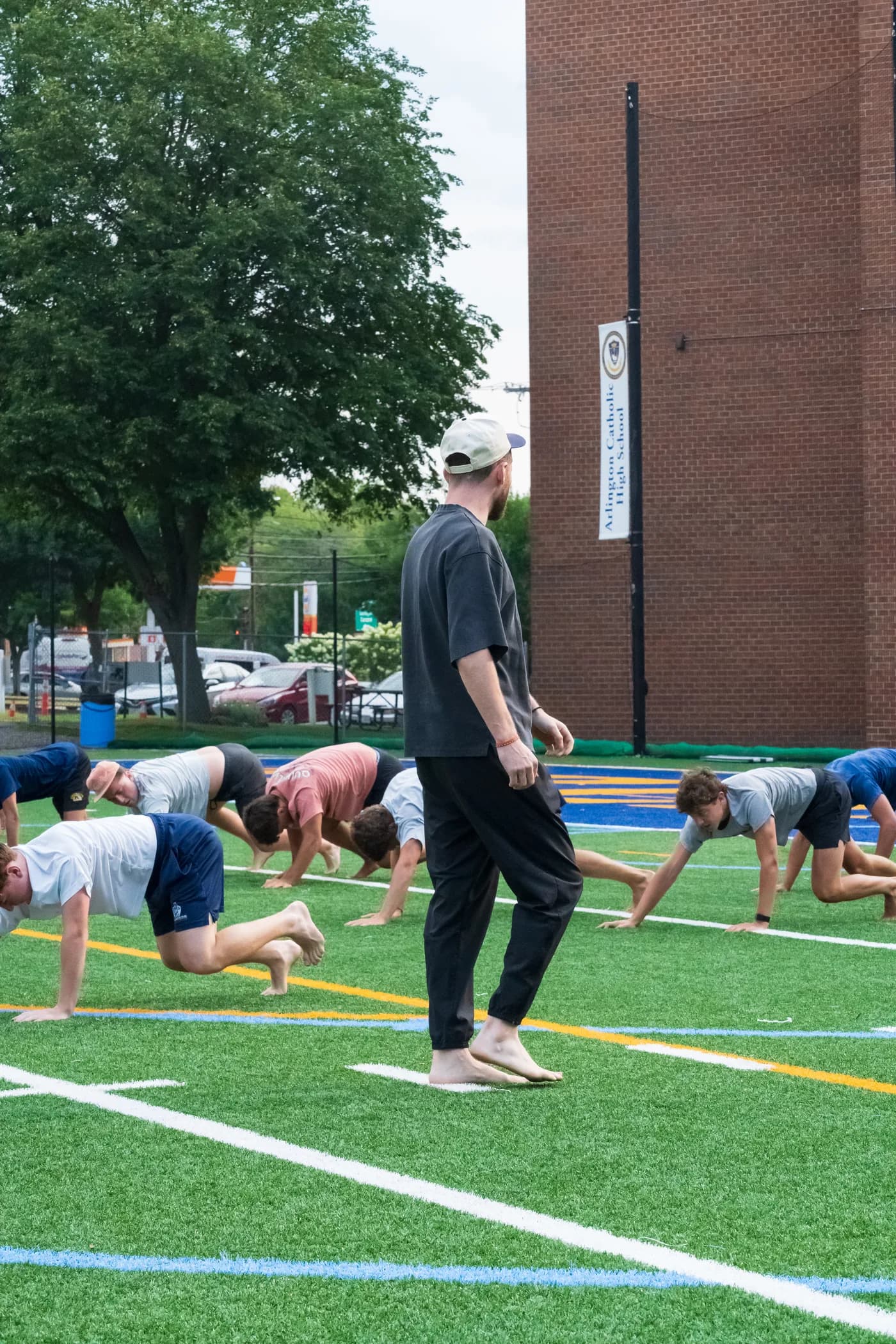 Steven Giardina coaching a row of crawls on the turf